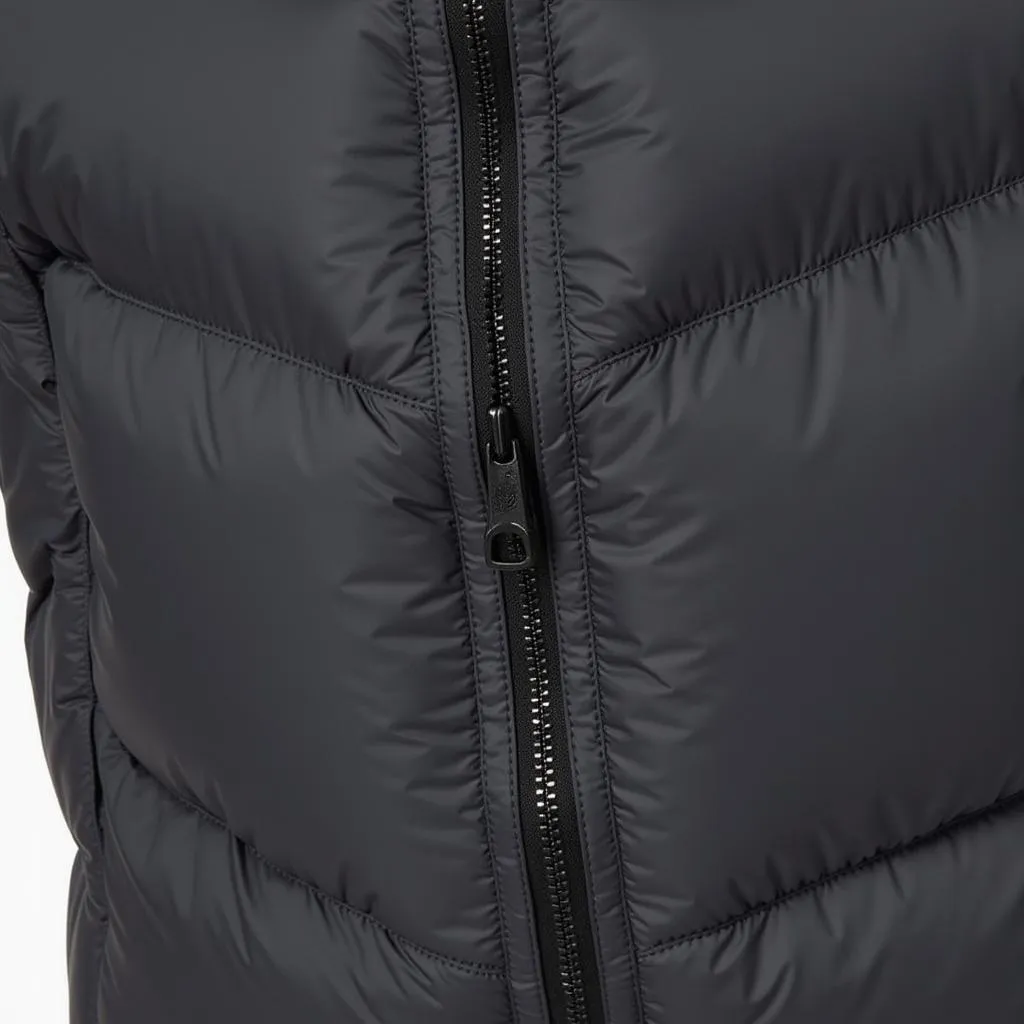 Detail of Outdoor Research Men's Helium Down Jacket zipper and pockets