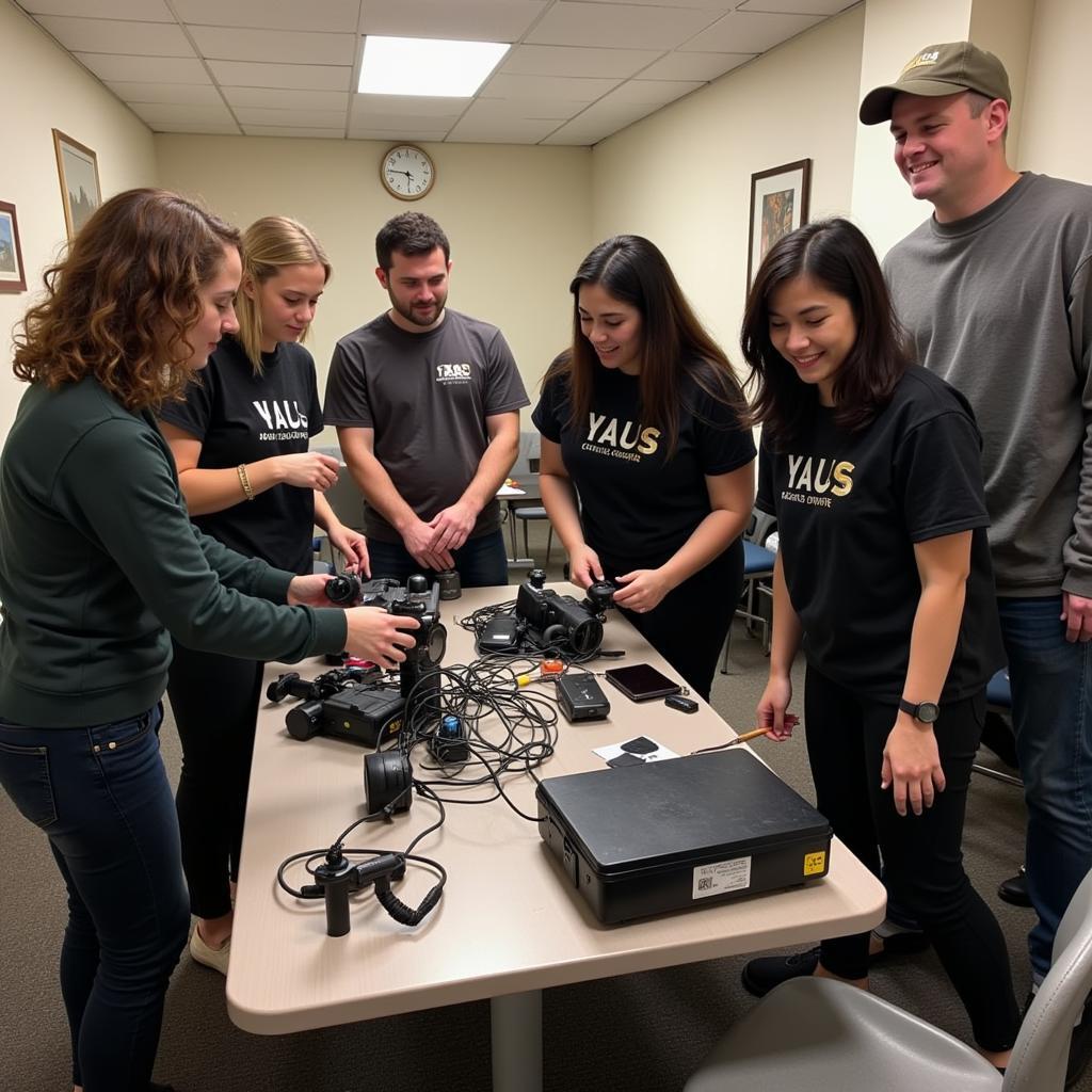 Group of volunteers setting up equipment for a paranormal investigation