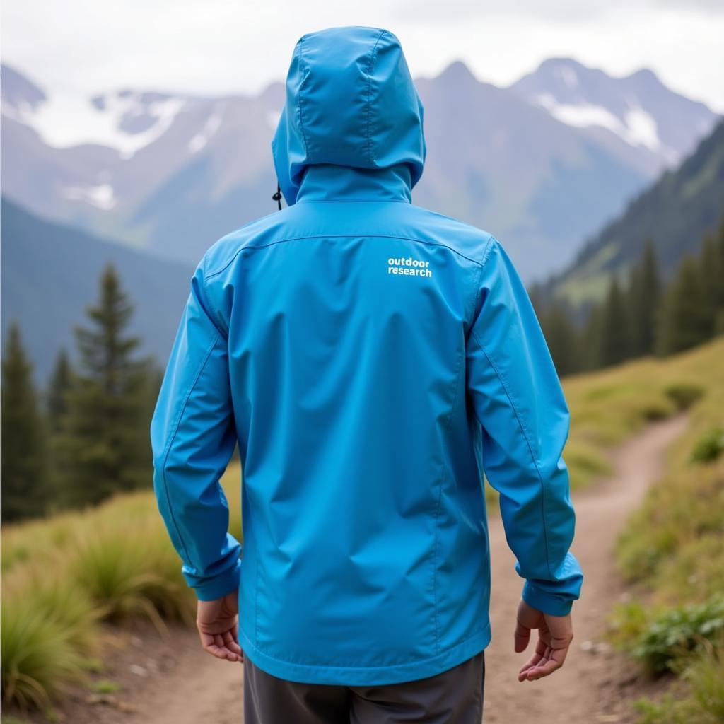 Man Hiking in Outdoor Research Rain Jacket