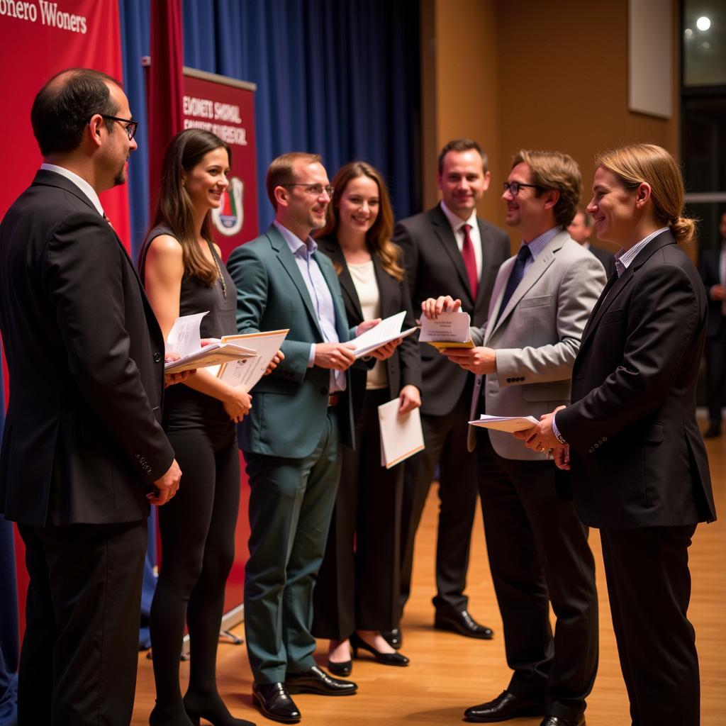 Researchers receiving awards at a ceremony