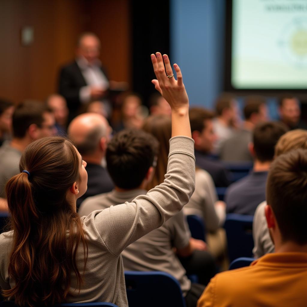 Students Asking Questions at a Symposium