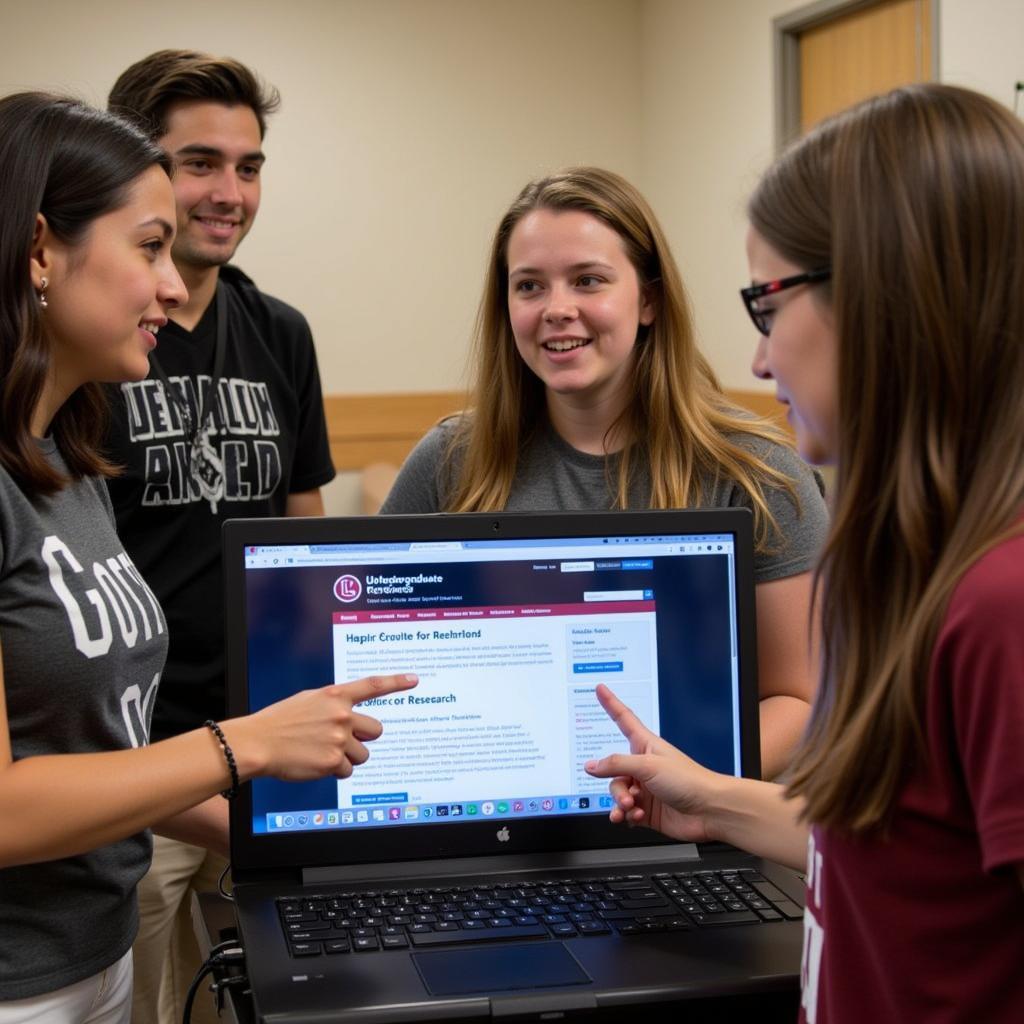 Students browsing UofSC undergraduate research office website