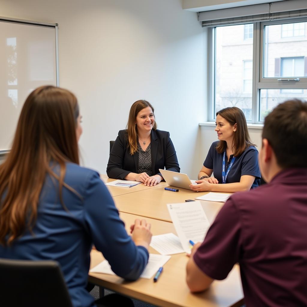 Clinical Research Associate II engaged in a meeting with site staff, discussing trial procedures.